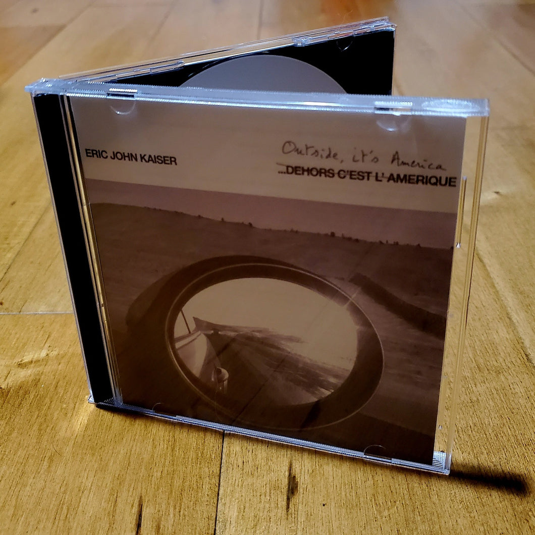 Dehors c'est l'Amérique  [Signed CD] + An Exclusive Bonus Tracks